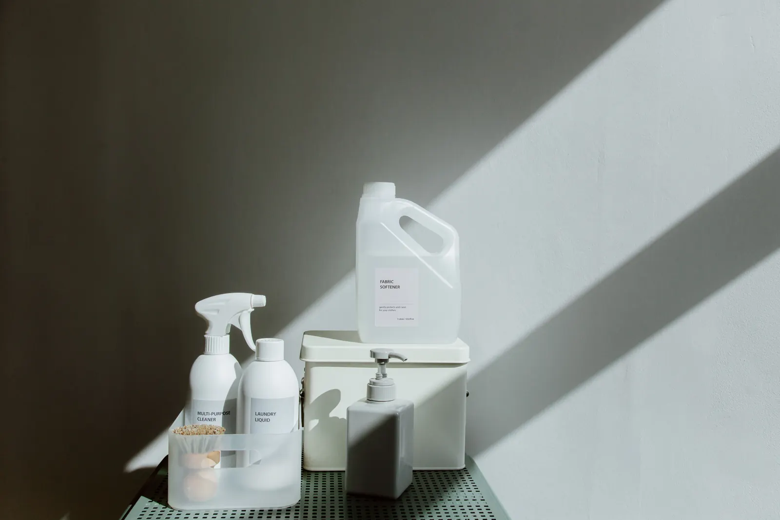 Household cleaning products arranged in natural light